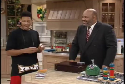 a man and a woman standing in a kitchen