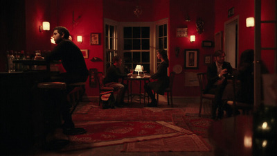 a group of people sitting around a table in a room