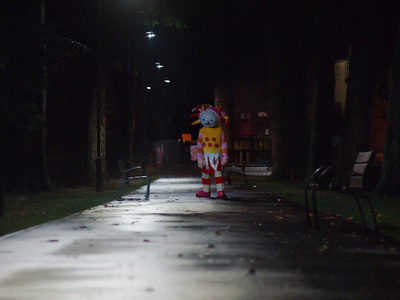 a large inflatable character standing on a sidewalk