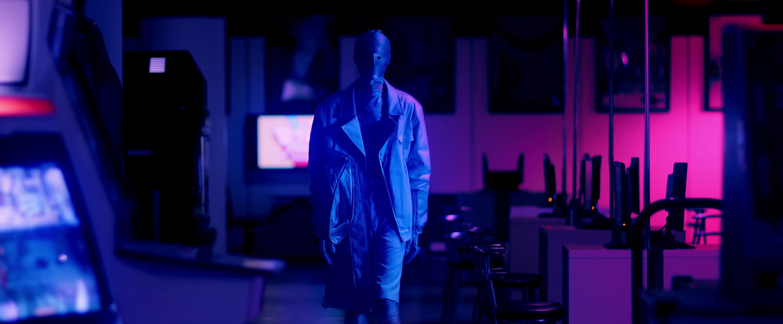 a man walking down a dark street at night