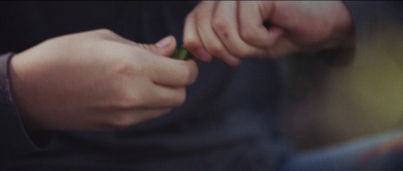 a close up of a person holding something in their hands