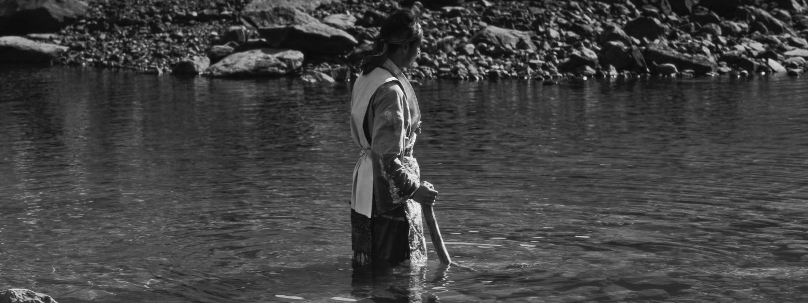 a man standing in a body of water