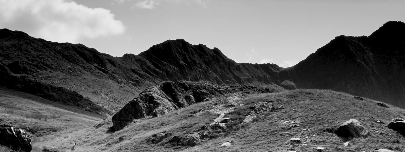 a black and white photo of a mountain range