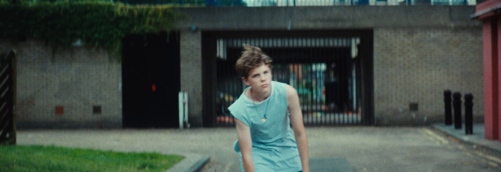 a young man riding a skateboard down a street