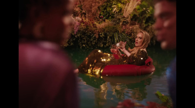 a woman sitting on a raft in the water