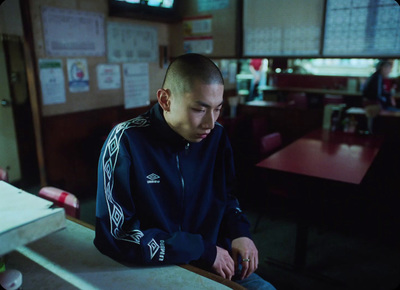 a man sitting at a table in a restaurant