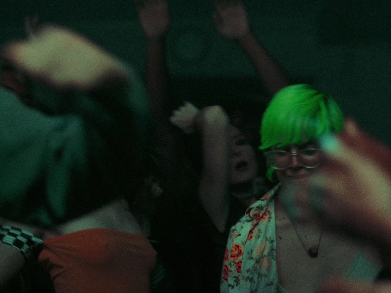 a group of people with green hair at a concert