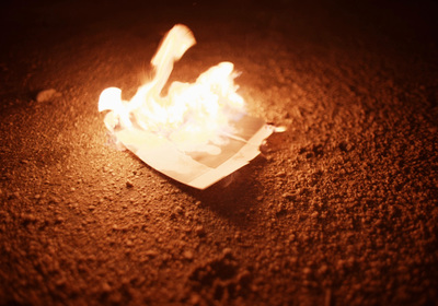 a piece of paper sitting on top of a fire pit