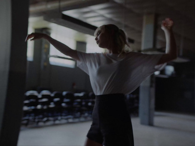 a woman in a white shirt and black shorts