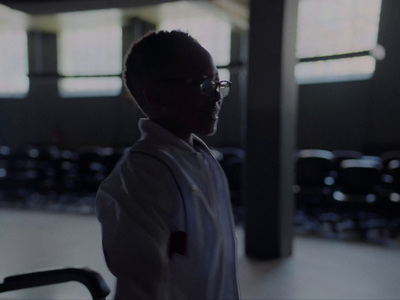 a man wearing glasses and a white shirt