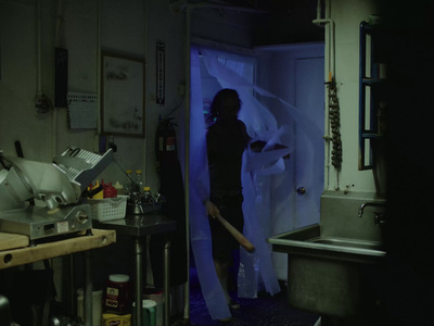 a woman standing in a kitchen next to a sink