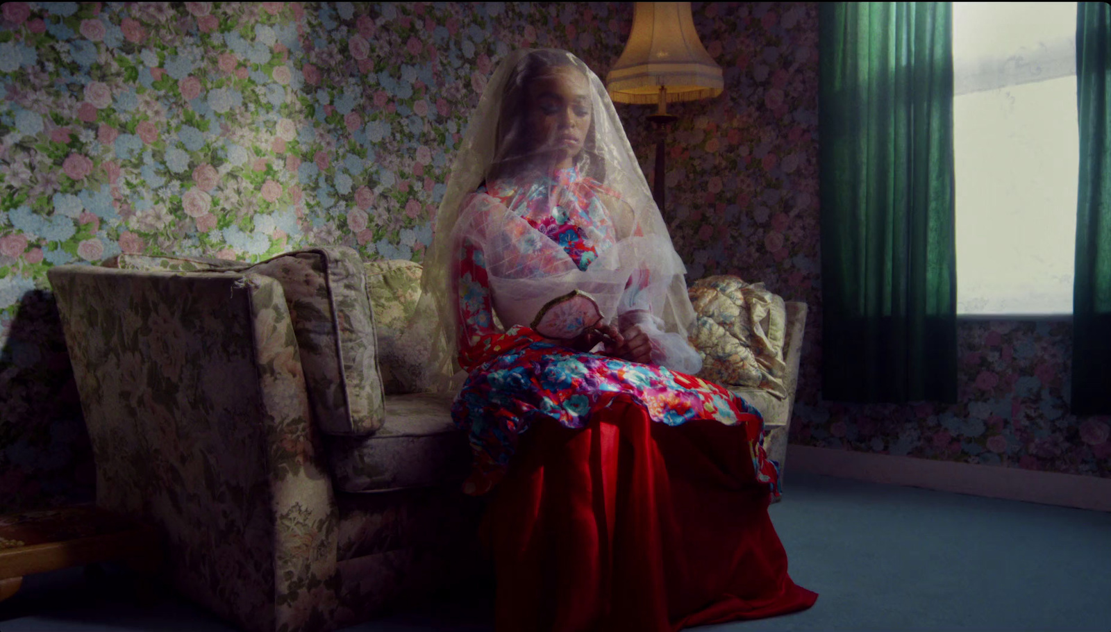 a woman in a wedding dress sitting on a chair