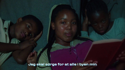 a group of young girls sitting next to each other