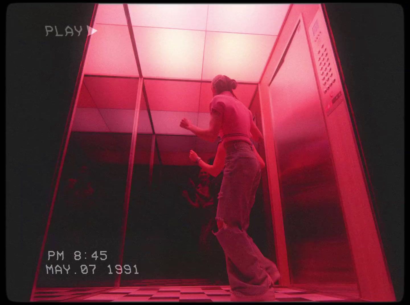 a man standing inside of a red room