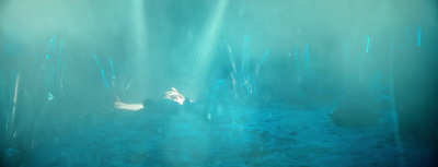 an underwater scene of a person swimming in the water