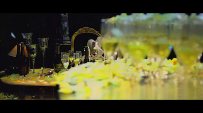 a table topped with lots of glasses filled with liquid