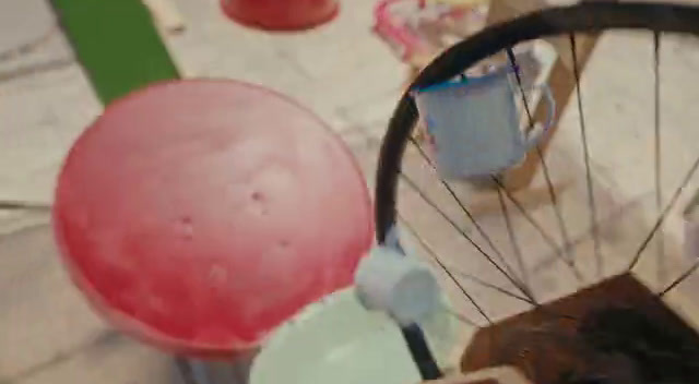 a close up of a bicycle wheel with a red ball on it