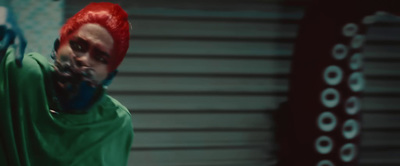 a man with red hair and a green shirt