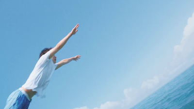 a person jumping into the air on a surfboard