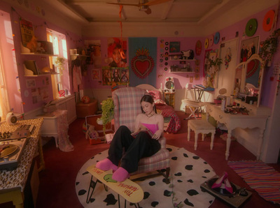 a woman sitting in a chair in a room