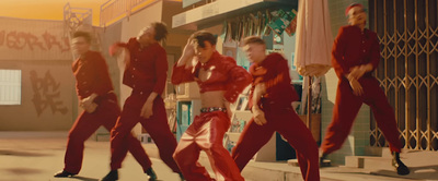 a group of men and women in red outfits