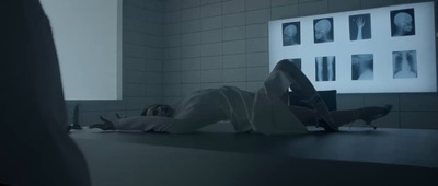 a person laying on the ground in a room