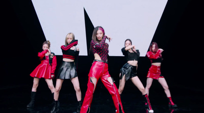 a group of young women standing on top of a stage