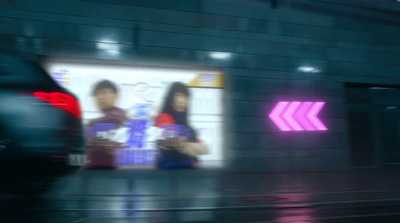 a blurry photo of two people standing in front of a building