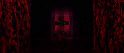 a person standing in a dark room with red curtains