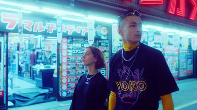 a man and a woman standing in front of a store