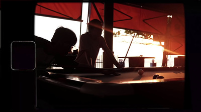 a man and a woman playing a game of pool