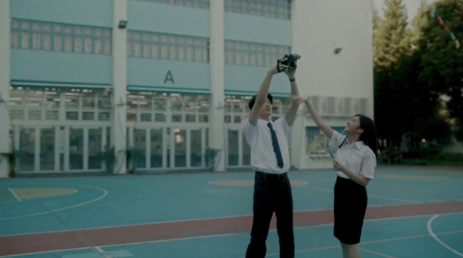 a couple of people that are standing in a court