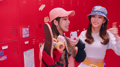 two young women standing in front of lockers