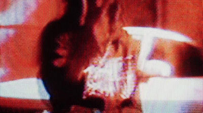 a blurry image of a woman holding a bag