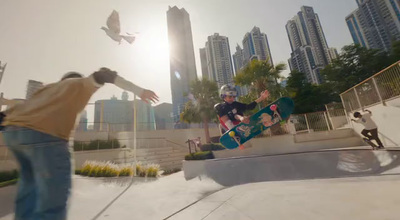 a man riding a skateboard up the side of a ramp