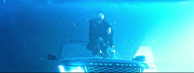 a man standing on top of a truck under water