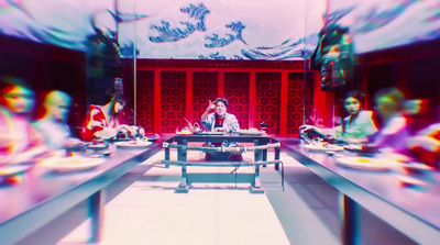 a blurry photo of a woman sitting at a table