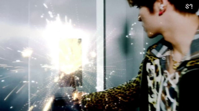 a person standing in front of a mirror with fireworks