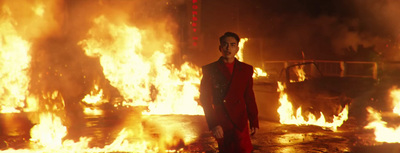 a man standing in front of a bunch of fire