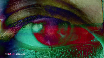 a close up of a person's eye with a blurry background