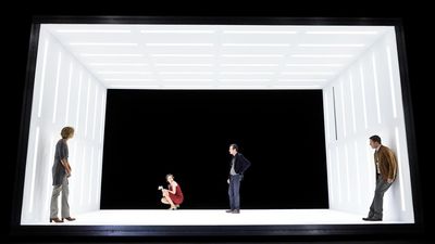 a group of people standing on top of a stage