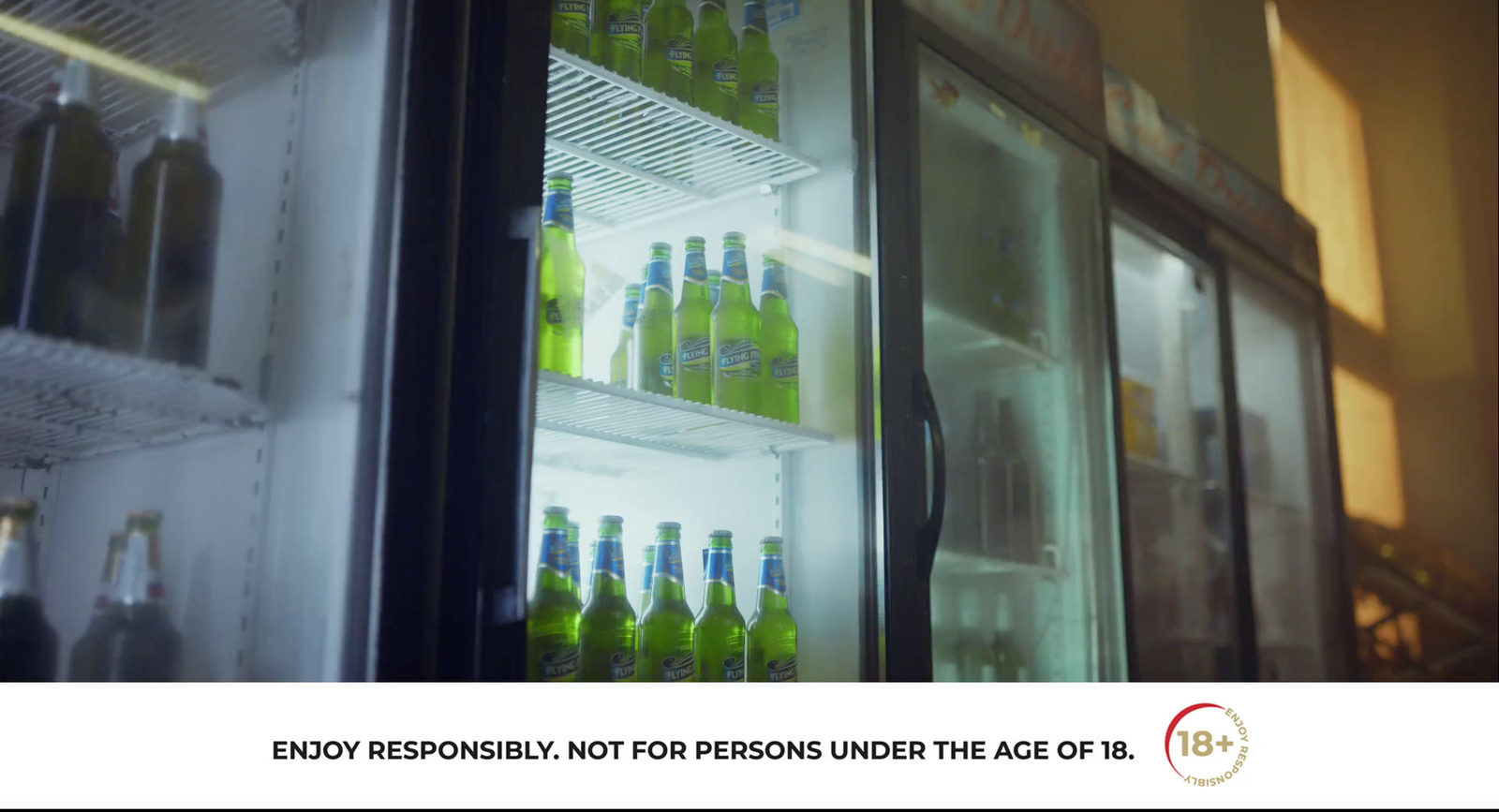 a refrigerator filled with lots of bottles of alcohol