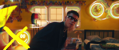 a man in sunglasses standing in a room