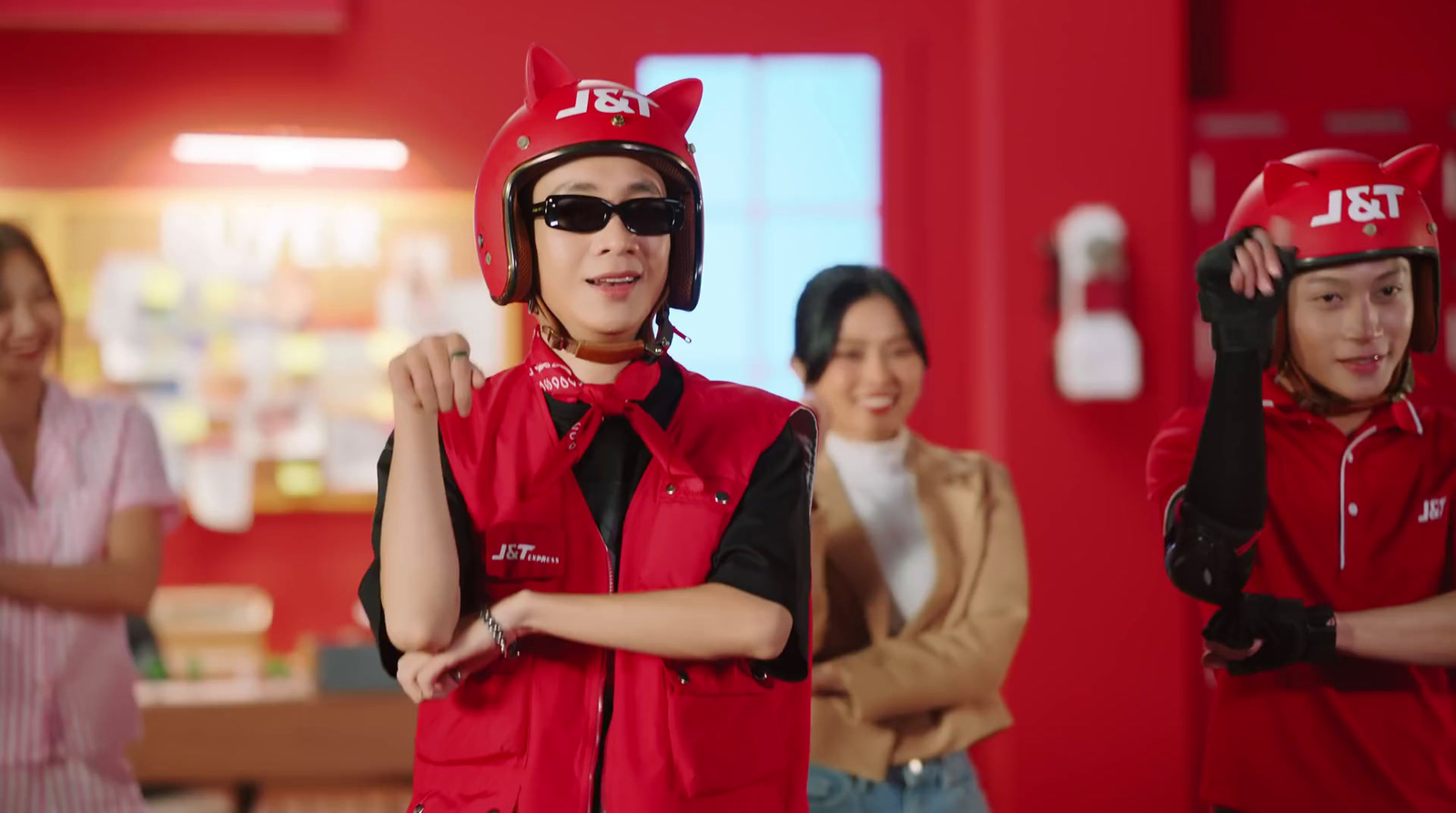 a group of young people wearing red helmets