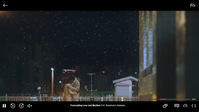 a person standing in front of a building at night