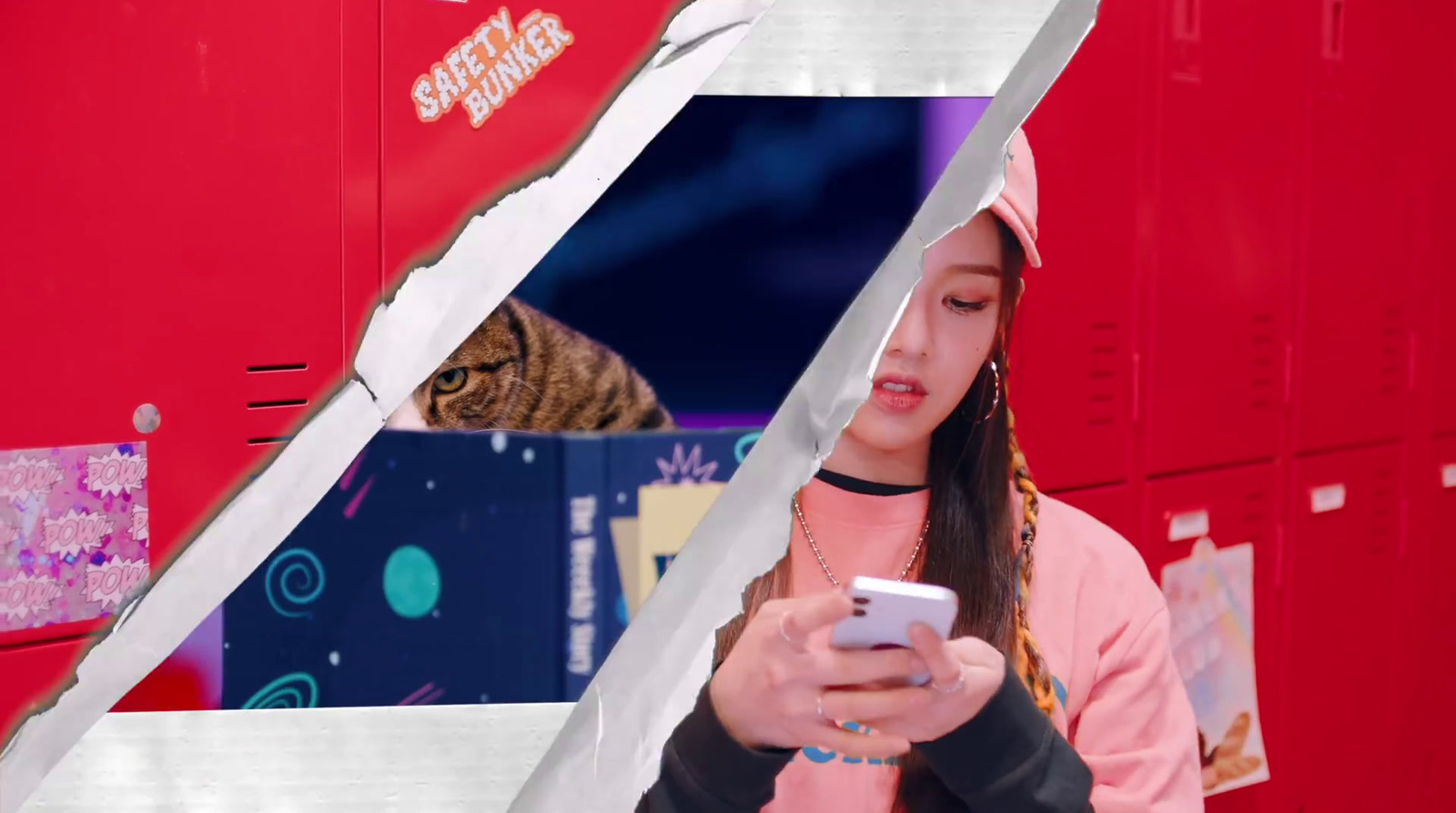 a woman looking at her cell phone while a cat looks on