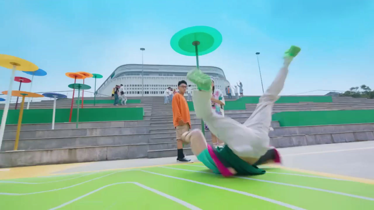 a man doing a handstand on a tennis court