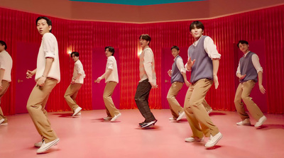 a group of young men dancing in a room