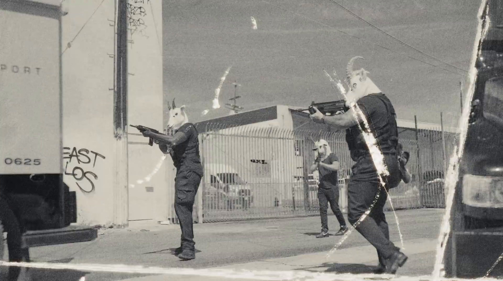 a black and white photo of people playing with a kite