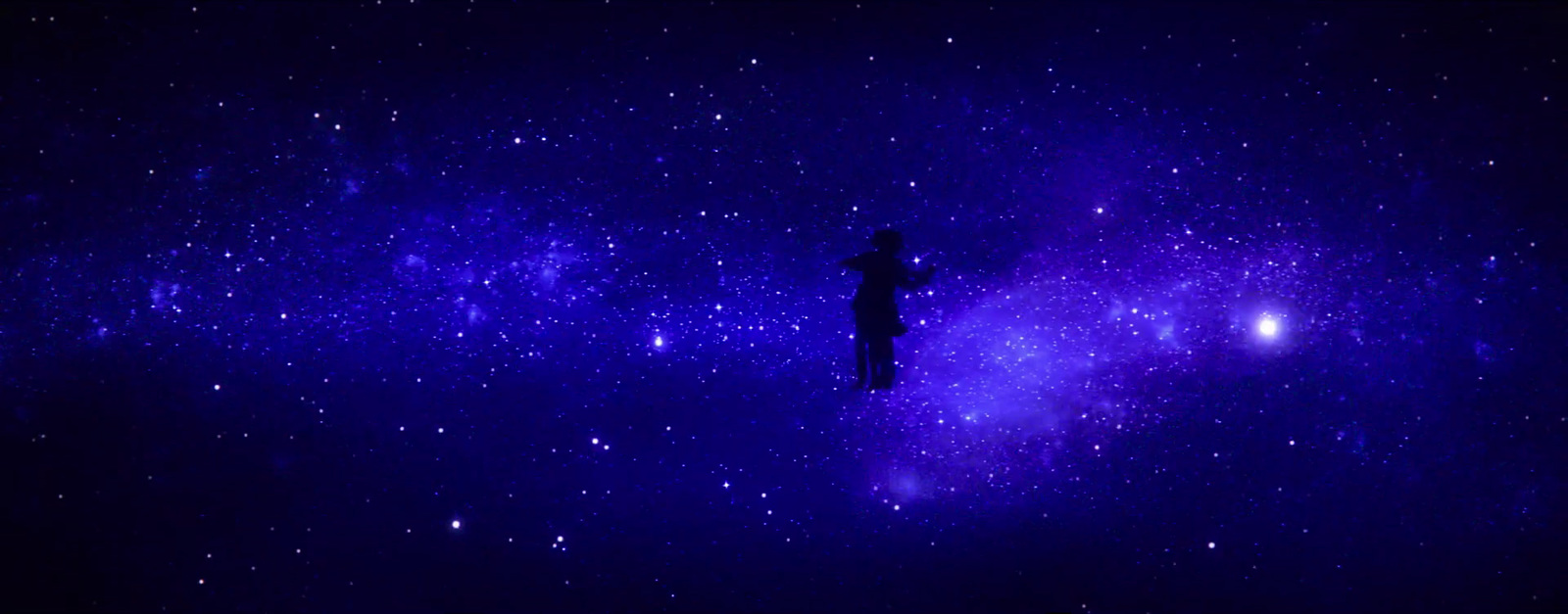 a person standing in the middle of a night sky